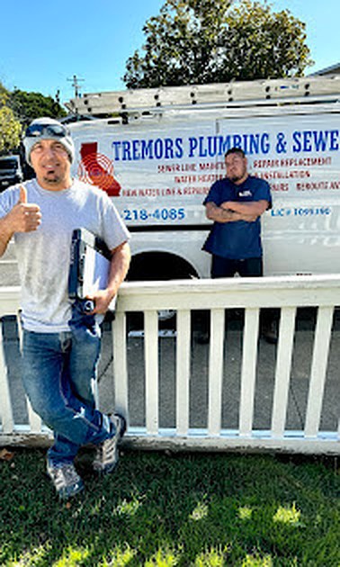 Francisco Zuno, left, with a Tremors technician in front of the company truck in San Mateo.